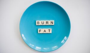 A doctor explains appetite suppressant options to a patient in a clinical office setting.