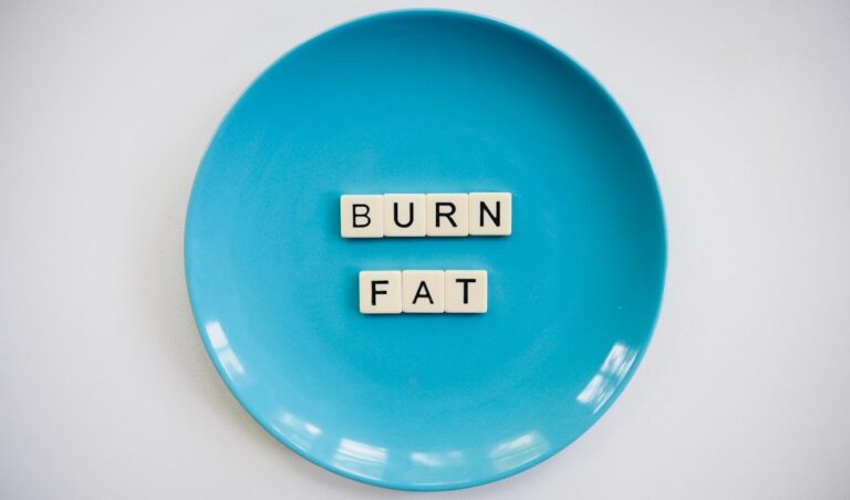 A doctor explains appetite suppressant options to a patient in a clinical office setting.